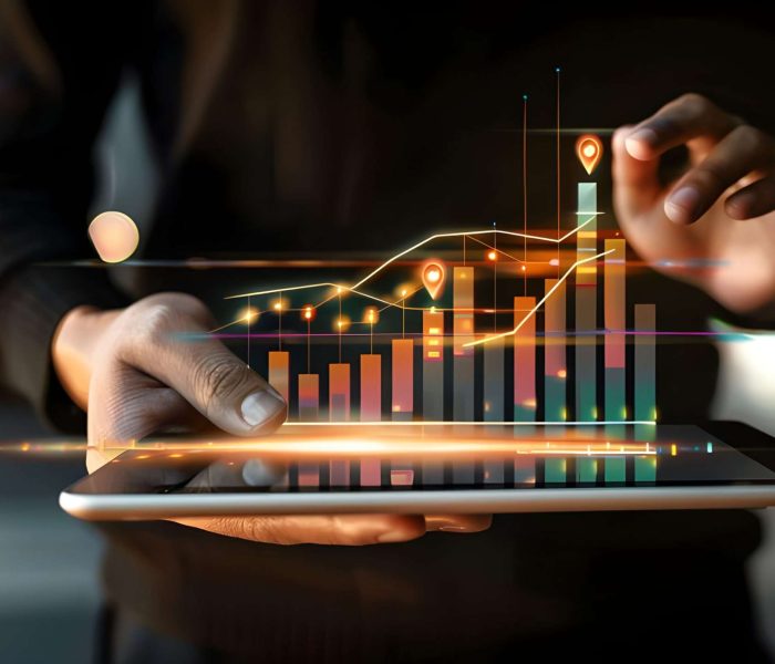 business-man-holding-tablet-showing-holographic-graphs-stock-market-statistics-gain-profits